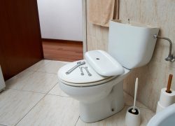 Jul24 EOE leaking toilet Plumbers tools on a leaking toilet