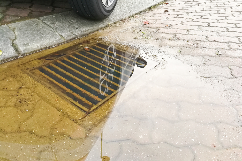 Waterlogged on street due to clogged drainage system
