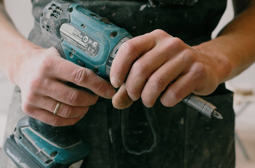 Handyman with tools - not the same as a licensed plumber