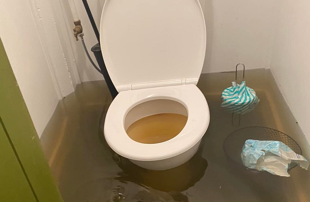 Flooded sewage system will be addressed in a plumbers report to the insurer