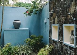 Outdoor shower installation in a tropical setting