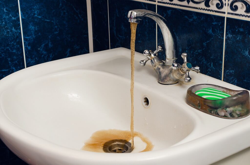Discoloured water coming from taps is a sign of plumbing problems