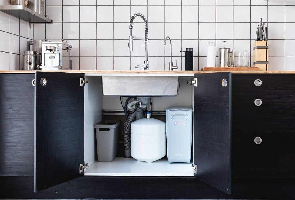 Under sink water filter installation in Sydney kitchen