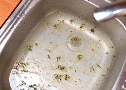 Slow draining kitchen sink with dirty water is a sign of a blocked drain