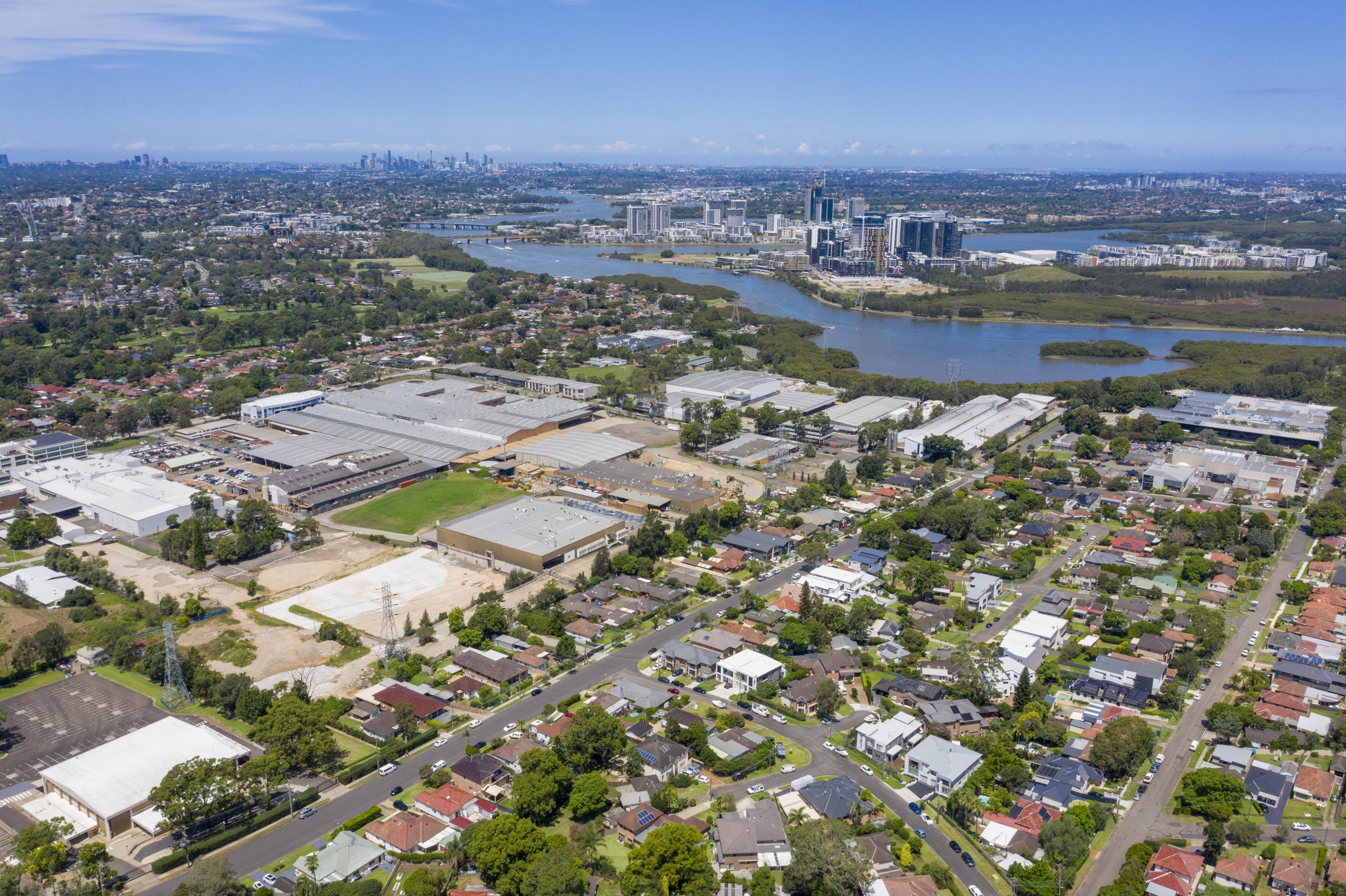 GPS Jun23 My Map - Ermington-min View from the sky of Ermington. View of river and CBD in background and suburbs in the foreground. Lots of trees. Gladesville Plumbing Services offers services for this area.