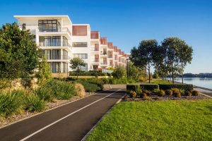Row of beautiful four storey blocks by the river in Rhodes. North Sydney Suburb with plenty of greenery. Service area for Gladesville Plumbing Services.