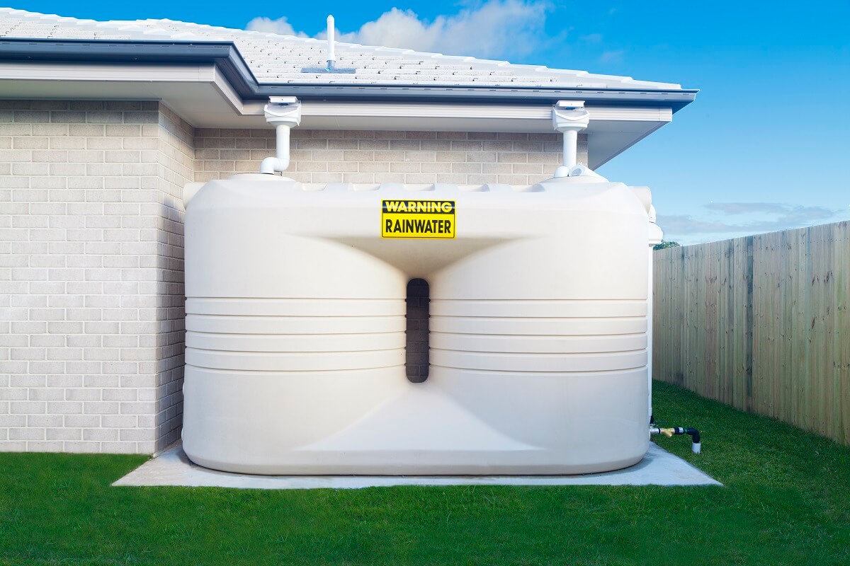 GPS Services - Rainwater Tank Rainwater tank in backyard, properly fitted by professional plumber in North Sydney.