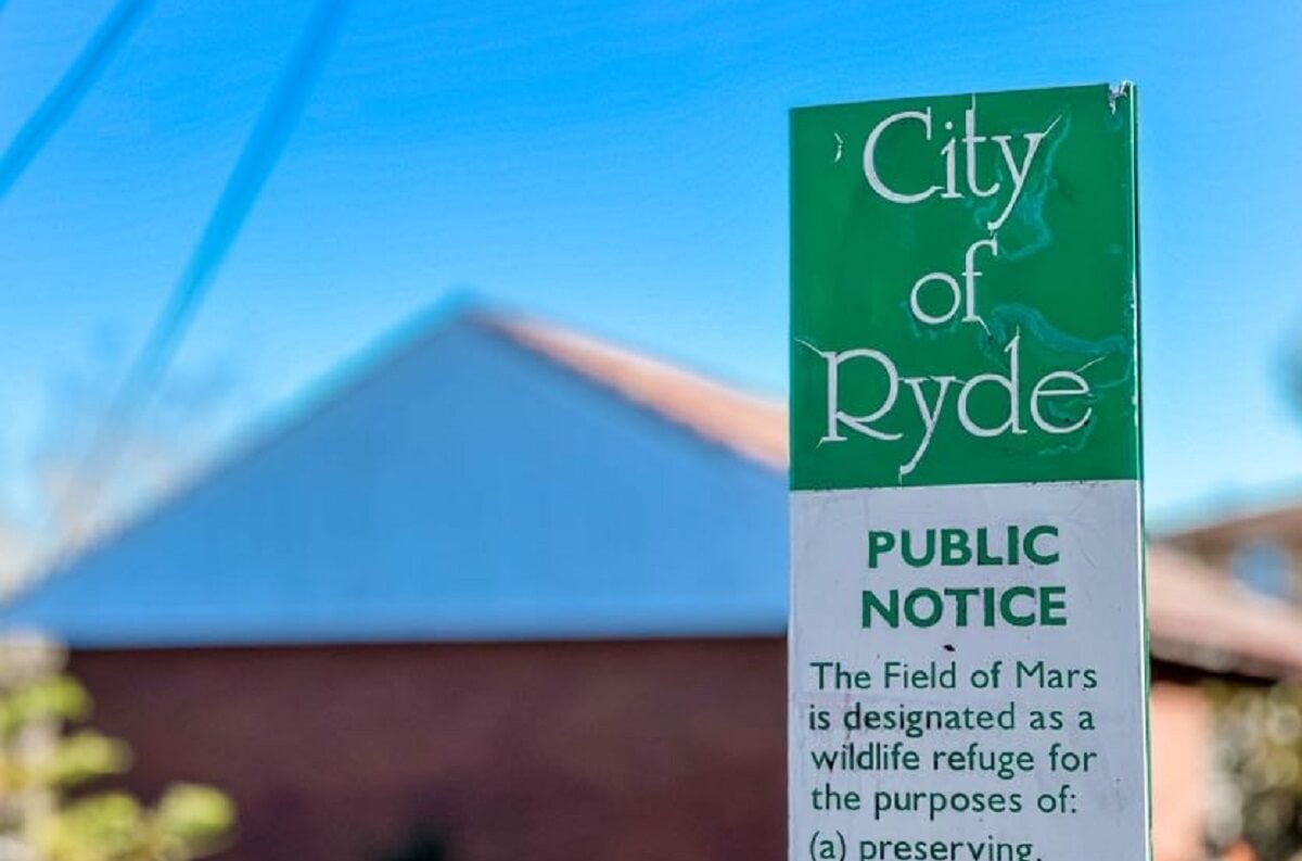 City of Ryde public notice sign regarding The Field of Mars wildlife refuge, within the Gladesville Plumbing service zone.