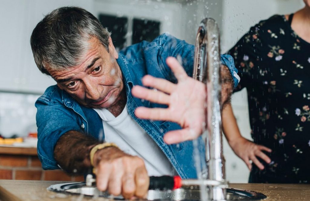 Water spraying everywhere because the water supply was not turned off before working - making a small plumbing job much bigger