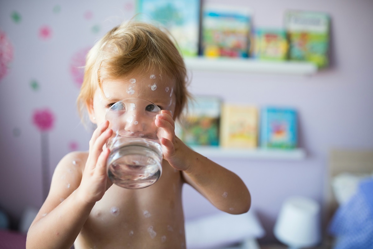 Young Australian child drinking water from Sydney's PFAs contaminated water supply